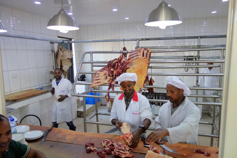 Kitfo butchers happily chopping away.