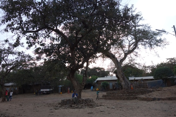 The village centre at dusk, where people come to chat with one another.