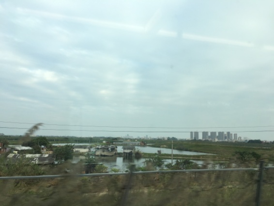 Highrise development encroaches on the Pearl River Delta's dwindling farmlands. Not the difference in living standards.