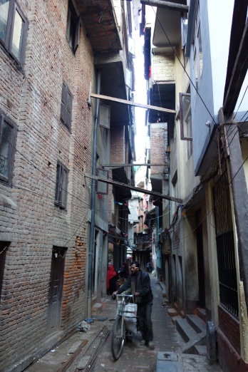 Many tight laneways have braces spanning from building to building in the aftermath of the 2015 earthquake.
